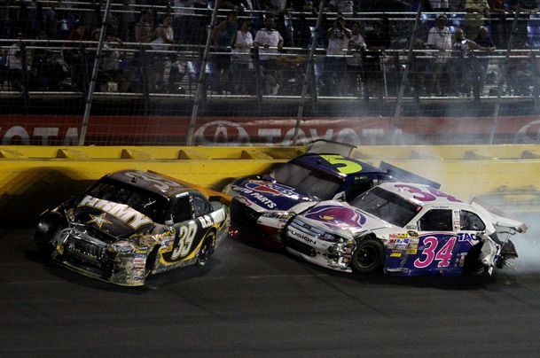 Ryan Newman, Mark Martin and David Gilliland get tangled up on lap 301 during the Coca-Cola 600 at Charlotte Motor Speedway. Credit: Jerry Markland/Getty Images for NASCAR